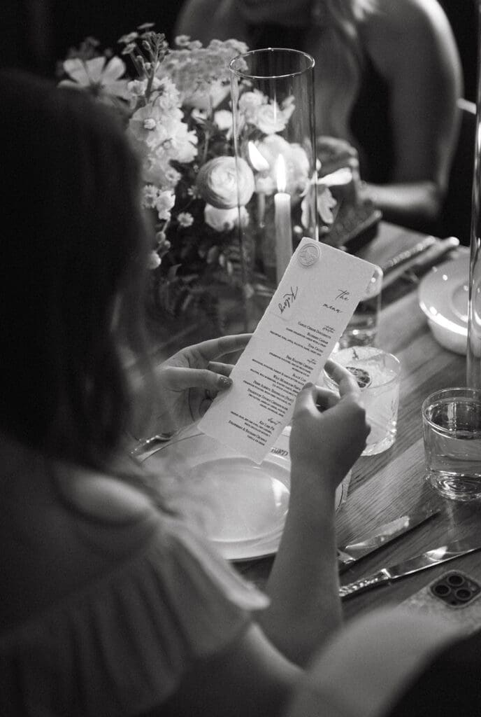 A guest looks over the menu for a Banff wedding reception 