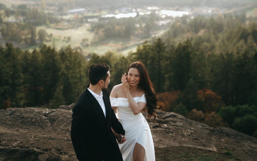 Couple exploring Vancouver Island Mount Douglas Location for engagement photos and pre wedding portraits