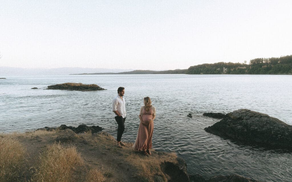 maternity engagement photos taken on beach in victoria amongst the west coast rock at sunset