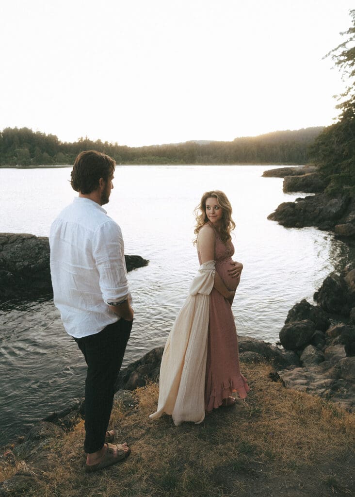 vancouver island engagement photos depict a couple standing near the water