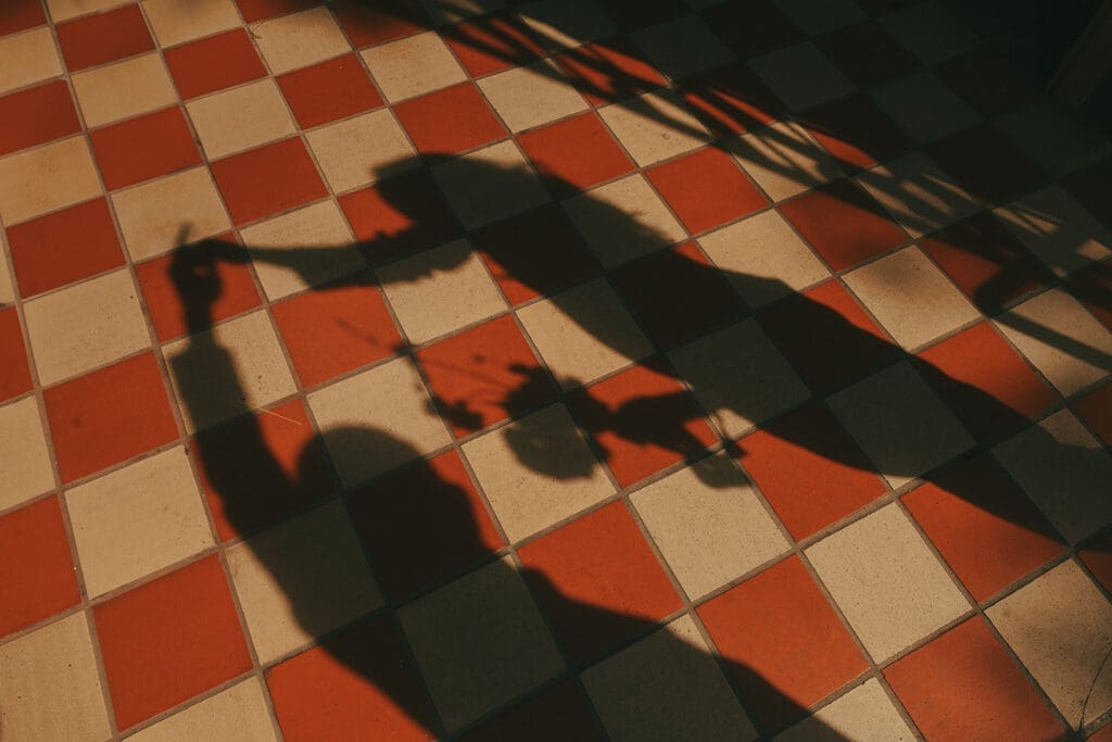 The shadow of a couple dancing in downtown Victoria is shown in vancouver engagement photos