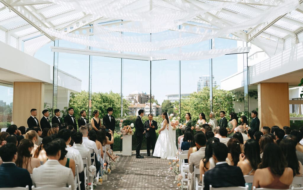 A ceremony is photographed at an inn at laurel point wedding