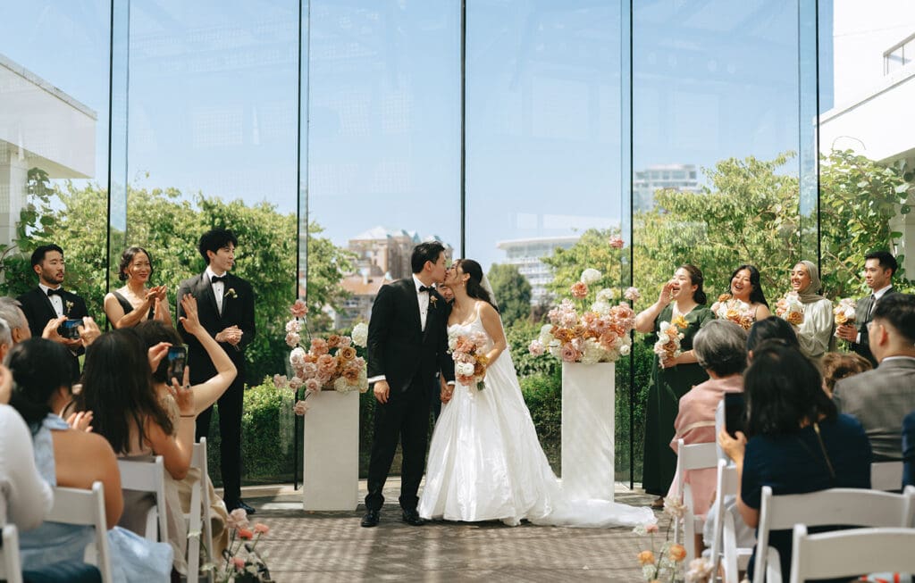 Newlyweds share a kiss at their inn at laurel point wedding ceremony