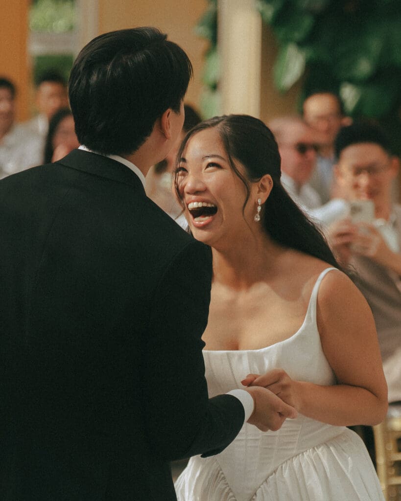 A bride and groom celebrate at their laurel point inn wedding reception