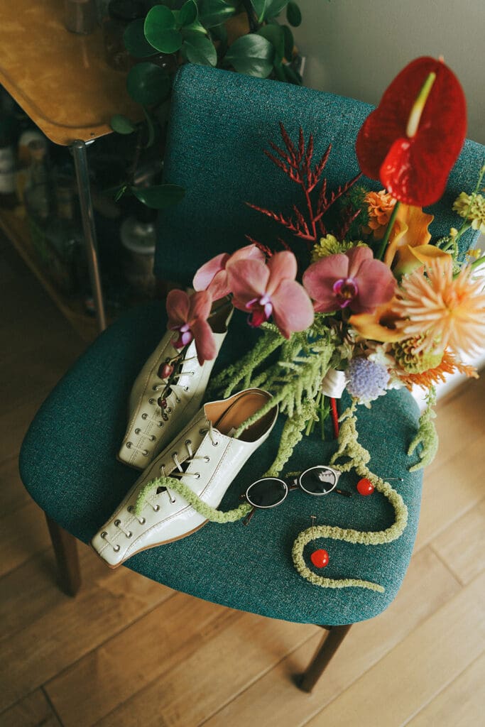 Colorful retro inspired wedding details are photographed before a wedding at  a hatley park wedding