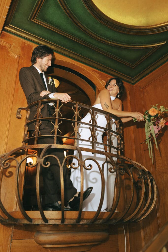 victoria bc wedding photography depicts newlyweds smiling in their 1970s inspired wedding attire